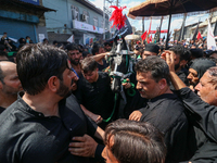 Kashmiri Shia Muslims are participating in the Ashura procession in Srinagar, Indian Administered Kashmir, on July 17, 2024. (