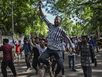 Students are shouting slogans during a protest against quotas in government jobs at the Dhaka University area, in Dhaka, Bangladesh, on July...