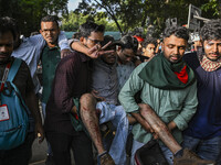 A student is being injured after police are firing rubber bullets to disperse anti-quota student protesters at the Dhaka University area, in...