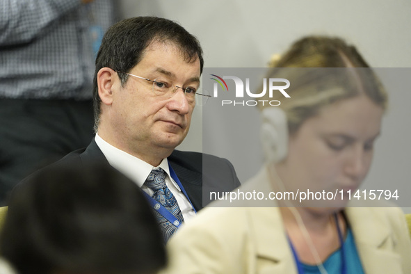 First Deputy Permanent Representative of the Russian Federation Dmitry Polyanskiy listens as Sergey Lavrov, Minister for Foreign Affairs of...