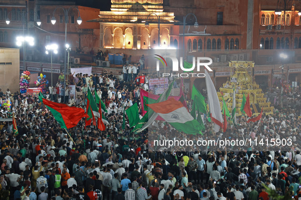 Indian Muslims are carrying 'Tazias' as they are taking part in a Muharram procession in Jaipur, Rajasthan, India, on July 17, 2024. During...