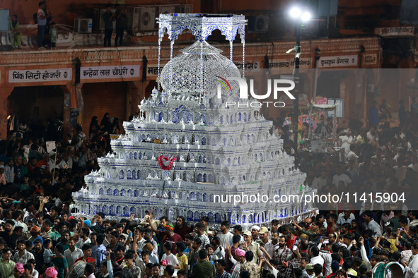 Indian Muslims are carrying 'Tazias' as they are taking part in a Muharram procession in Jaipur, Rajasthan, India, on July 17, 2024. During...