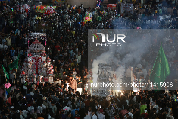 Indian Muslims are carrying 'Tazias' as they are taking part in a Muharram procession in Jaipur, Rajasthan, India, on July 17, 2024. During...