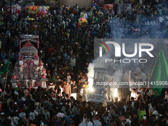 Indian Muslims are carrying 'Tazias' as they are taking part in a Muharram procession in Jaipur, Rajasthan, India, on July 17, 2024. During...