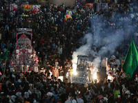 Indian Muslims are carrying 'Tazias' as they are taking part in a Muharram procession in Jaipur, Rajasthan, India, on July 17, 2024. During...