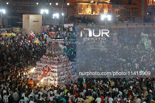 Indian Muslims are carrying 'Tazias' as they are taking part in a Muharram procession in Jaipur, Rajasthan, India, on July 17, 2024. During...