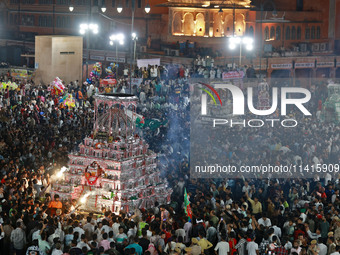 Indian Muslims are carrying 'Tazias' as they are taking part in a Muharram procession in Jaipur, Rajasthan, India, on July 17, 2024. During...