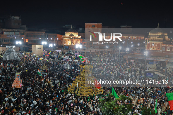 Indian Muslims are carrying 'Tazias' as they are taking part in a Muharram procession in Jaipur, Rajasthan, India, on July 17, 2024. During...