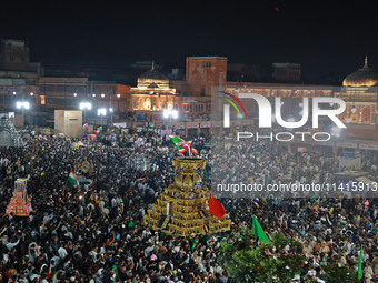 Indian Muslims are carrying 'Tazias' as they are taking part in a Muharram procession in Jaipur, Rajasthan, India, on July 17, 2024. During...