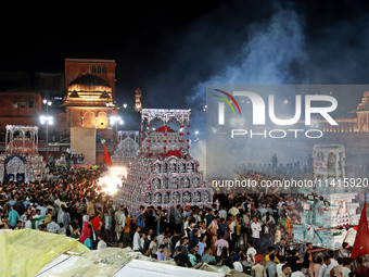 Indian Muslims are carrying 'Tazias' as they are taking part in a Muharram procession in Jaipur, Rajasthan, India, on July 17, 2024. During...