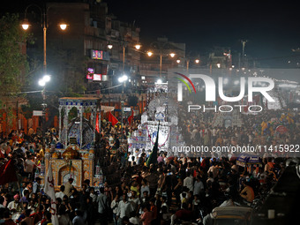 Indian Muslims are carrying 'Tazias' as they are taking part in a Muharram procession in Jaipur, Rajasthan, India, on July 17, 2024. During...