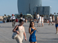 People are spending the afternoon in the city center at the gates of the first heat wave on the Iberian Peninsula, in Barcelona, Spain, on J...