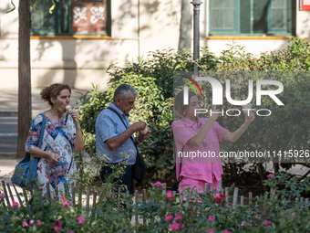 People are spending the afternoon in the city center at the gates of the first heat wave on the Iberian Peninsula, in Barcelona, Spain, on J...