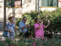 People are spending the afternoon in the city center at the gates of the first heat wave on the Iberian Peninsula, in Barcelona, Spain, on J...