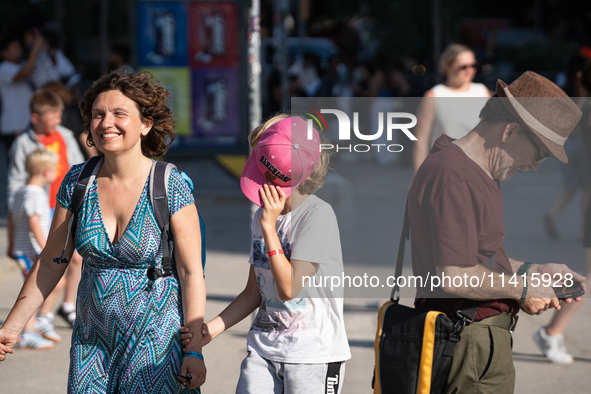 People are spending the afternoon in the city center at the gates of the first heat wave on the Iberian Peninsula, in Barcelona, Spain, on J...