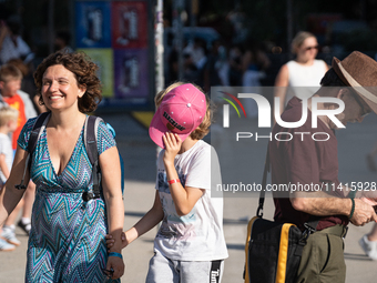 People are spending the afternoon in the city center at the gates of the first heat wave on the Iberian Peninsula, in Barcelona, Spain, on J...