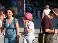 People are spending the afternoon in the city center at the gates of the first heat wave on the Iberian Peninsula, in Barcelona, Spain, on J...