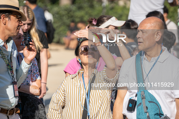 People are spending the afternoon in the city center at the gates of the first heat wave on the Iberian Peninsula, in Barcelona, Spain, on J...