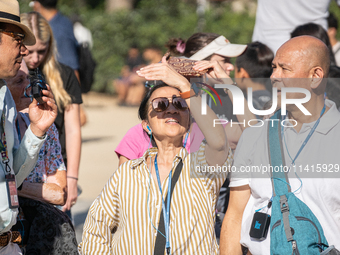 People are spending the afternoon in the city center at the gates of the first heat wave on the Iberian Peninsula, in Barcelona, Spain, on J...