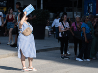 People are spending the afternoon in the city center at the gates of the first heat wave on the Iberian Peninsula, in Barcelona, Spain, on J...