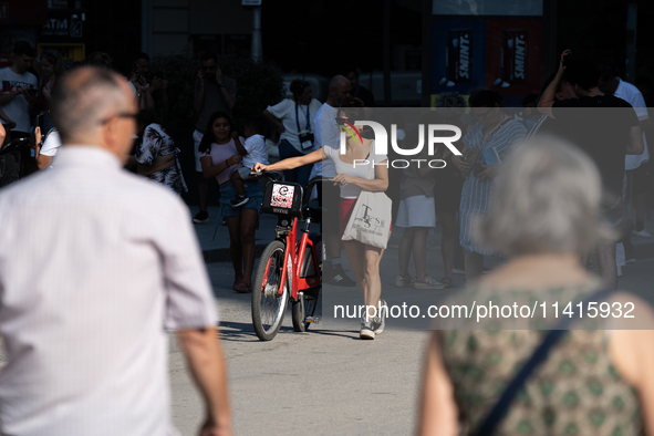 People are spending the afternoon in the city center at the gates of the first heat wave on the Iberian Peninsula, in Barcelona, Spain, on J...