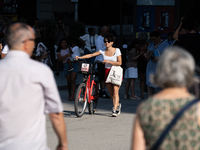 People are spending the afternoon in the city center at the gates of the first heat wave on the Iberian Peninsula, in Barcelona, Spain, on J...