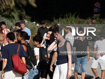 People are spending the afternoon in the city center at the gates of the first heat wave on the Iberian Peninsula, in Barcelona, Spain, on J...