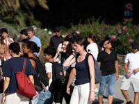 People are spending the afternoon in the city center at the gates of the first heat wave on the Iberian Peninsula, in Barcelona, Spain, on J...