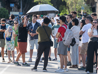 People are spending the afternoon in the city center at the gates of the first heat wave on the Iberian Peninsula, in Barcelona, Spain, on J...