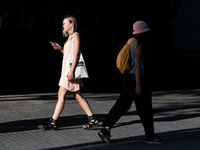 People are spending the afternoon in the city center at the gates of the first heat wave on the Iberian Peninsula, in Barcelona, Spain, on J...