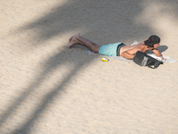 People are spending the afternoon in the city center at the gates of the first heat wave on the Iberian Peninsula, in Barcelona, Spain, on J...