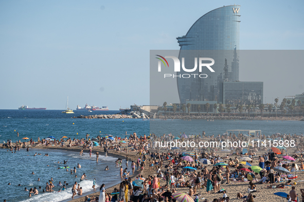 People are spending the afternoon in the city center at the gates of the first heat wave on the Iberian Peninsula, in Barcelona, Spain, on J...