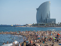 People are spending the afternoon in the city center at the gates of the first heat wave on the Iberian Peninsula, in Barcelona, Spain, on J...