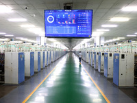 Spinning equipment is working automatically at a 5G smart factory in Fuzhou, China, on July 17, 2024. (