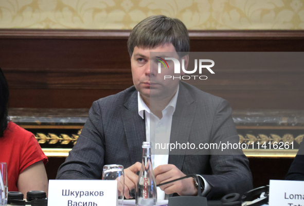 Vasyl Shkurakov, Acting Minister of Communities, Territories, and Infrastructure Development of Ukraine, is attending the meeting of the Cou...