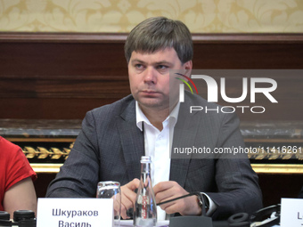 Vasyl Shkurakov, Acting Minister of Communities, Territories, and Infrastructure Development of Ukraine, is attending the meeting of the Cou...