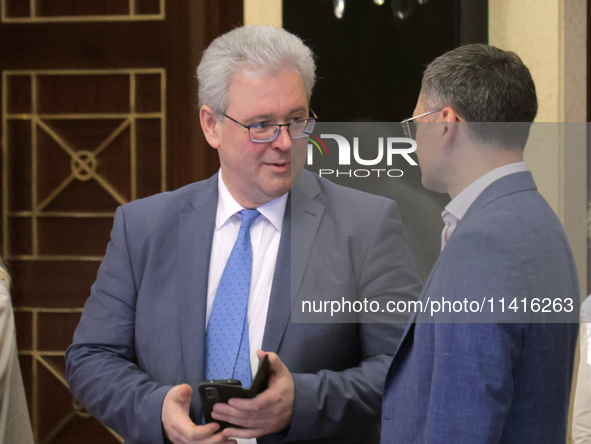 Ukrainian diplomat Yevhen Tsymbaliuk (L) and Minister of Foreign Affairs of Ukraine Dmytro Kuleba are attending the meeting of the Council f...