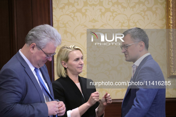 Ukrainian diplomat Yevhen Tsymbaliuk (L), US Ambassador Extraordinary and Plenipotentiary to Ukraine Bridget Brink, and Minister of Foreign...