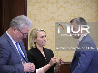 Ukrainian diplomat Yevhen Tsymbaliuk (L), US Ambassador Extraordinary and Plenipotentiary to Ukraine Bridget Brink, and Minister of Foreign...