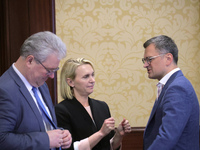 Ukrainian diplomat Yevhen Tsymbaliuk (L), US Ambassador Extraordinary and Plenipotentiary to Ukraine Bridget Brink, and Minister of Foreign...