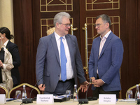 Ukrainian diplomat Yevhen Tsymbaliuk (L) and Minister of Foreign Affairs of Ukraine Dmytro Kuleba are attending the meeting of the Council f...