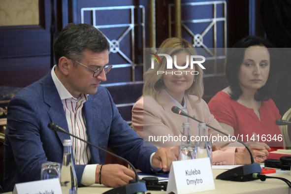 Minister of Foreign Affairs of Ukraine Dmytro Kuleba, First Lady Olena Zelenska, and Minister of Social Policy Oksana Zholnovych (L to R) ar...