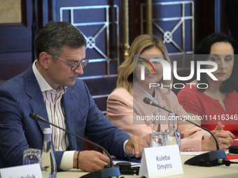 Minister of Foreign Affairs of Ukraine Dmytro Kuleba, First Lady Olena Zelenska, and Minister of Social Policy Oksana Zholnovych (L to R) ar...