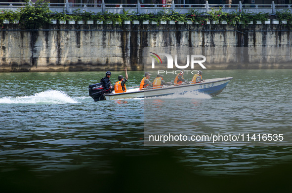 Armed police are training for flood control and rescue in Baise, China, on July 12, 2024. 