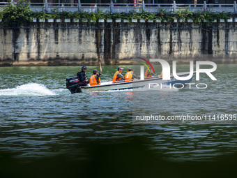 Armed police are training for flood control and rescue in Baise, China, on July 12, 2024. (