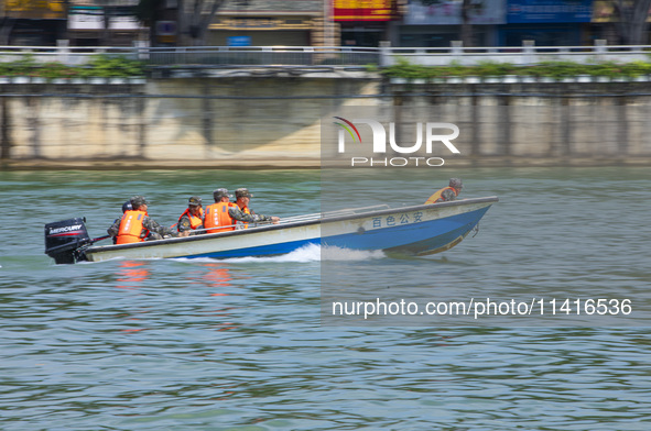 Armed police are training for flood control and rescue in Baise, China, on July 12, 2024. 