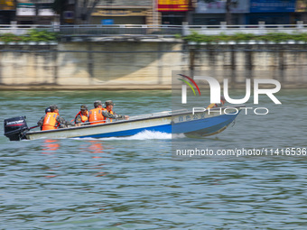 Armed police are training for flood control and rescue in Baise, China, on July 12, 2024. (