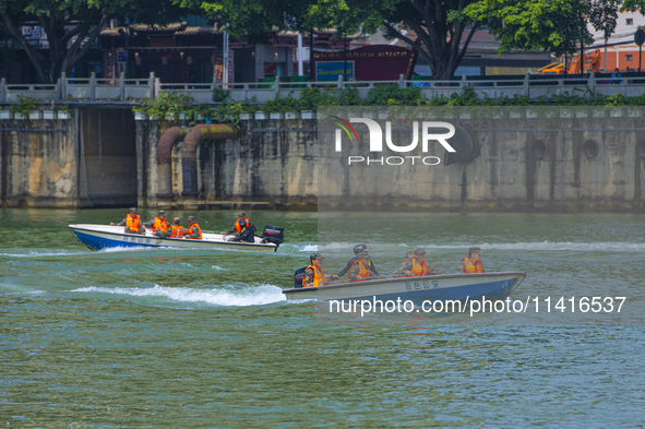 Armed police are training for flood control and rescue in Baise, China, on July 12, 2024. 