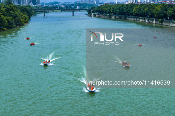 Armed police are training for flood control and rescue in Baise, China, on July 12, 2024. 