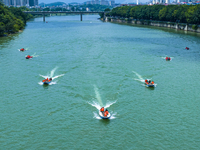 Armed police are training for flood control and rescue in Baise, China, on July 12, 2024. (